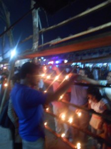 People lighting the lamp