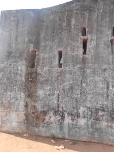 The musket points on the wall