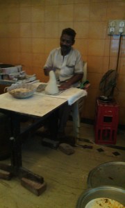 The cook with the lump of kneaded dough for Bhakri.
